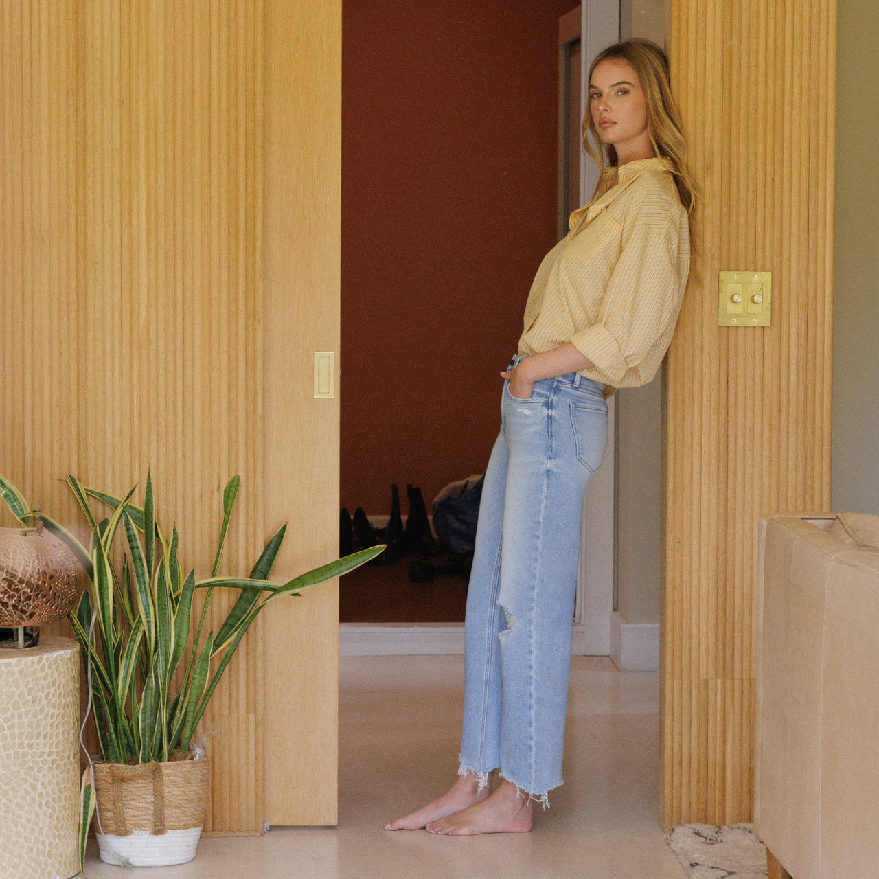 Model in High Rise Distressed Crop Slim Wide Jeans and striped shirt, linking to full Flying Monkey collection.