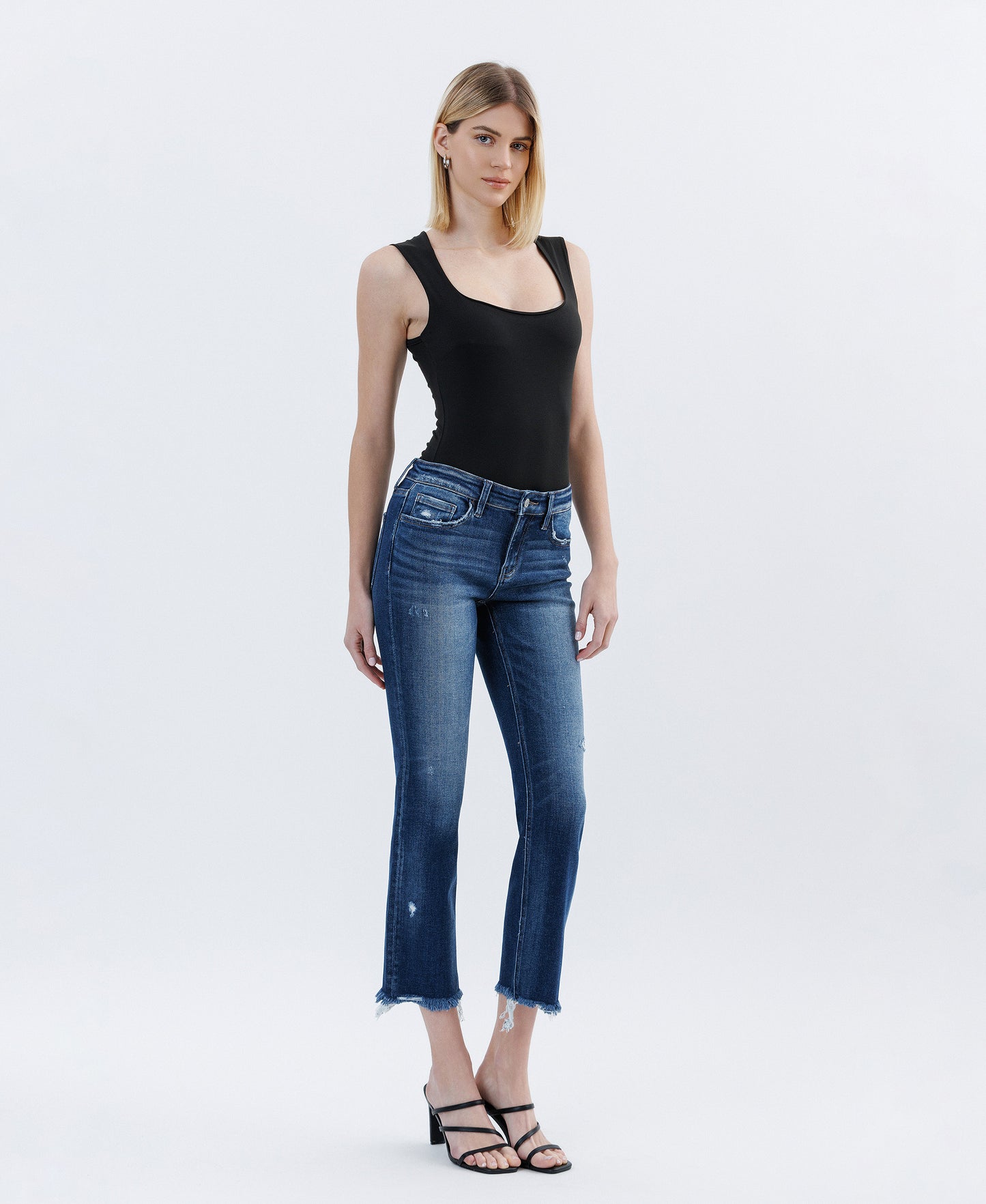 Right 45 degrees product image of Stunned - Low Rise Raw Hem Crop Slim Straight Jeans
