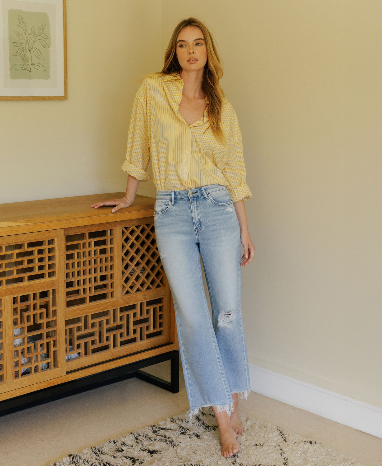 Editorial image of Ezra - High Rise Distressed Crop Slim Wide Leg Jeans
