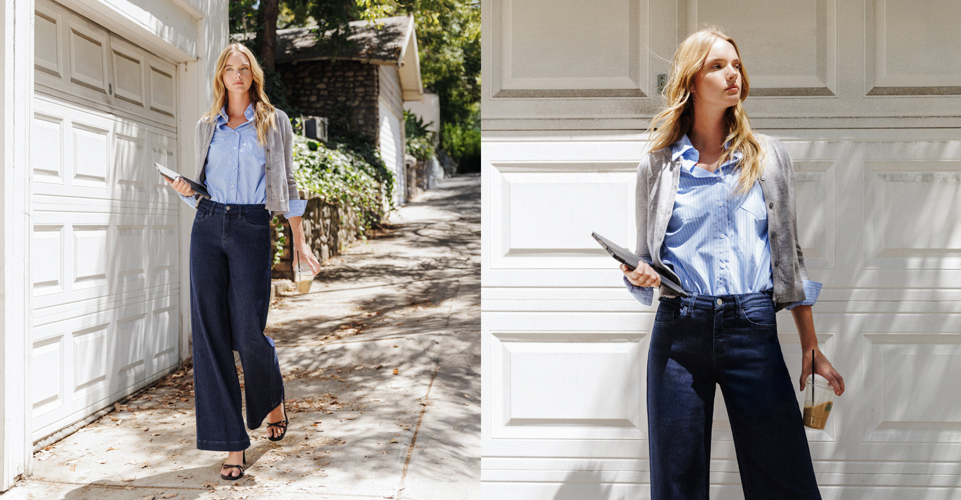 Model wearing Flying Monkey’s High Rise Seamless WB Trouser Hem Wide Jeans, styled with a light blue striped button-up shirt and a gray cardigan draped over the shoulders. She holds an iced coffee and tablet while walking outdoors along a sunlit residential driveway beside a white garage.