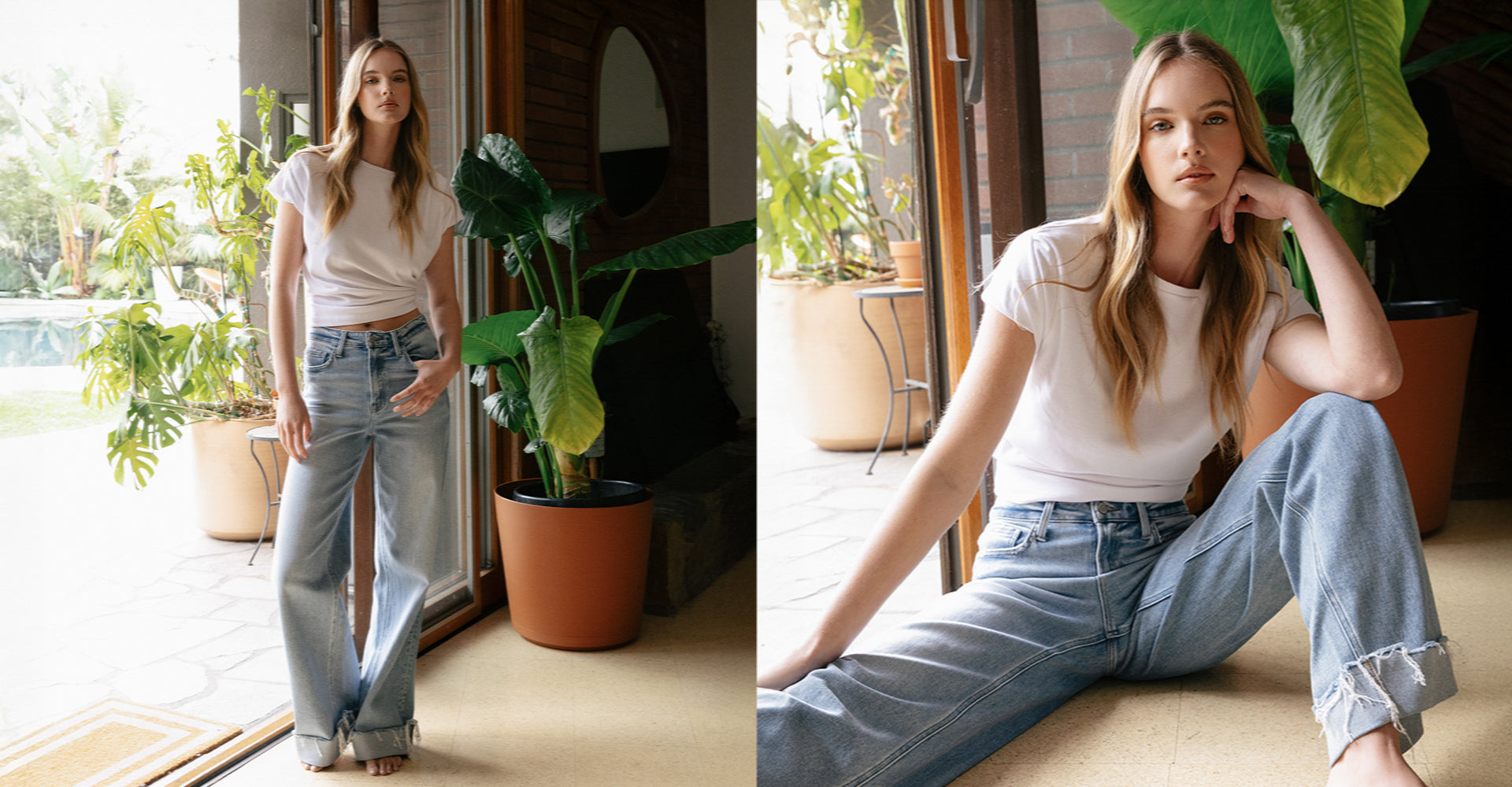 Wearing Flying Monkey’s Super High Rise Cuffed Wide Jeans and a white t-shirt, model stands and sits in a relaxed indoor setting.