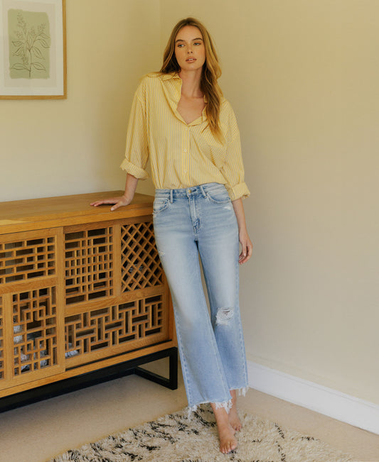 Editorial image of Ezra - High Rise Distressed Crop Slim Wide Leg Jeans
