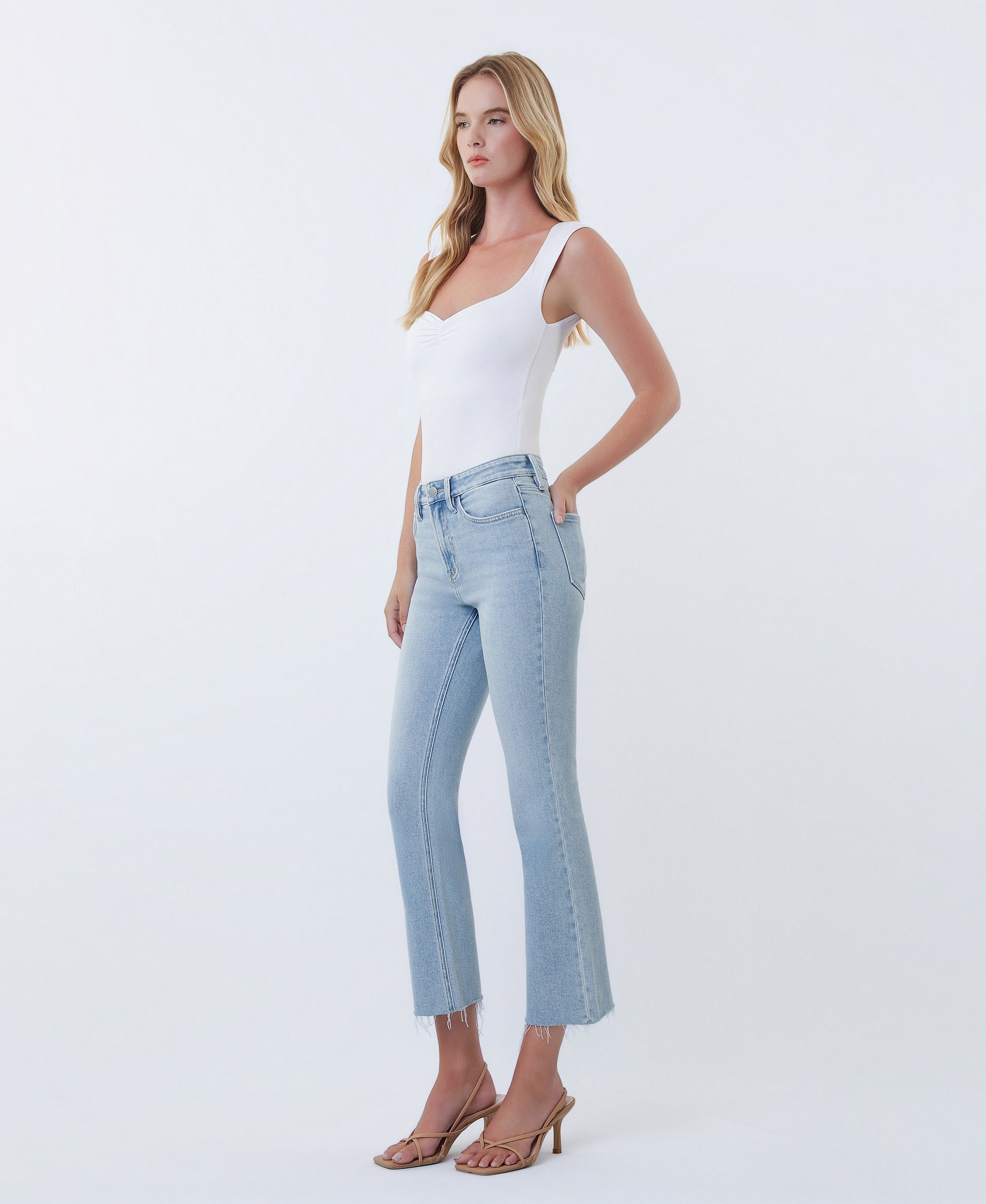 Left 45 degrees product image of Astonishing - High Rise Raw Hem Kick Flare Jeans