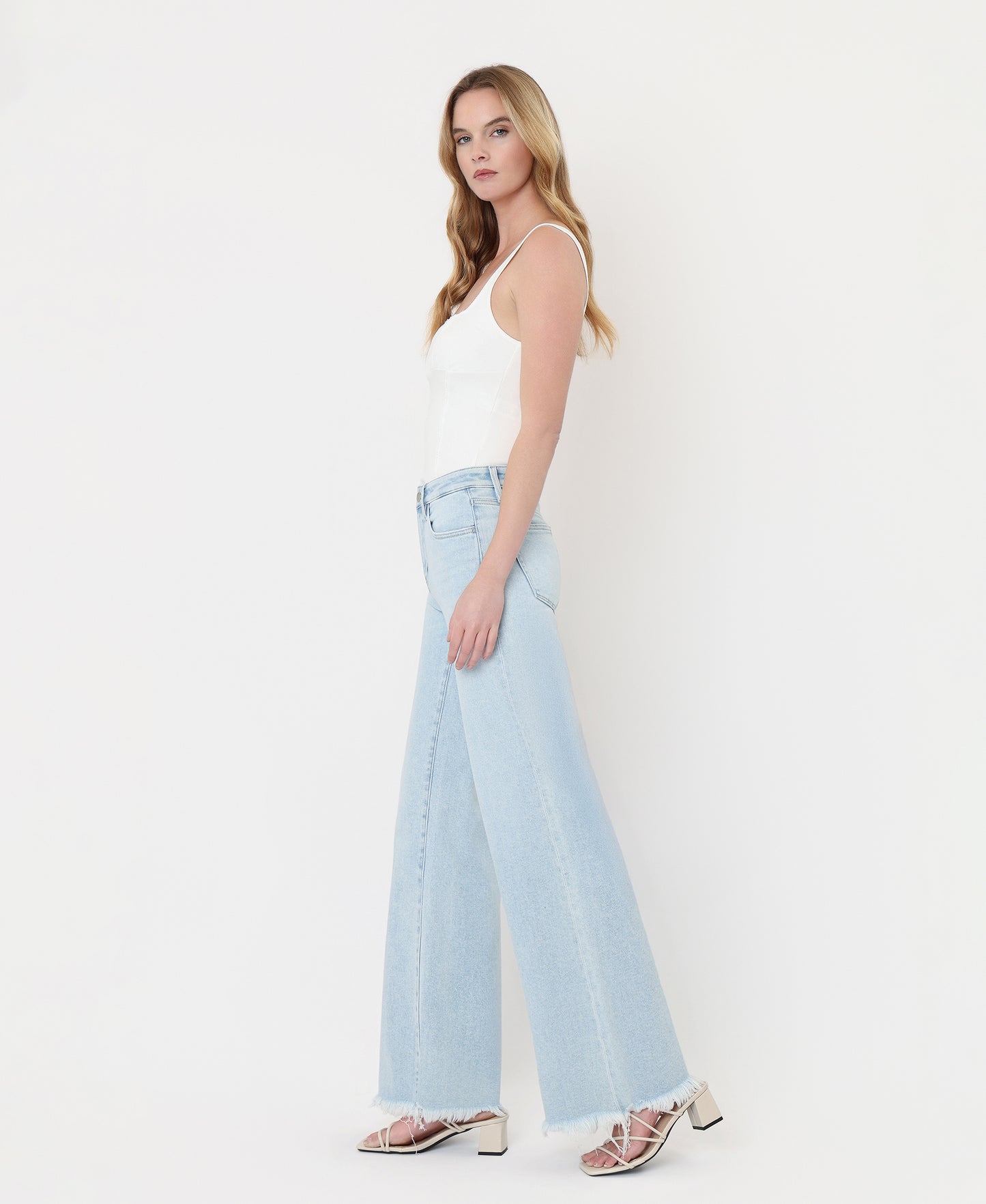 Left side product images of Blue Ringer - High Rise Uneven Frayed Hem Wide Leg Jeans