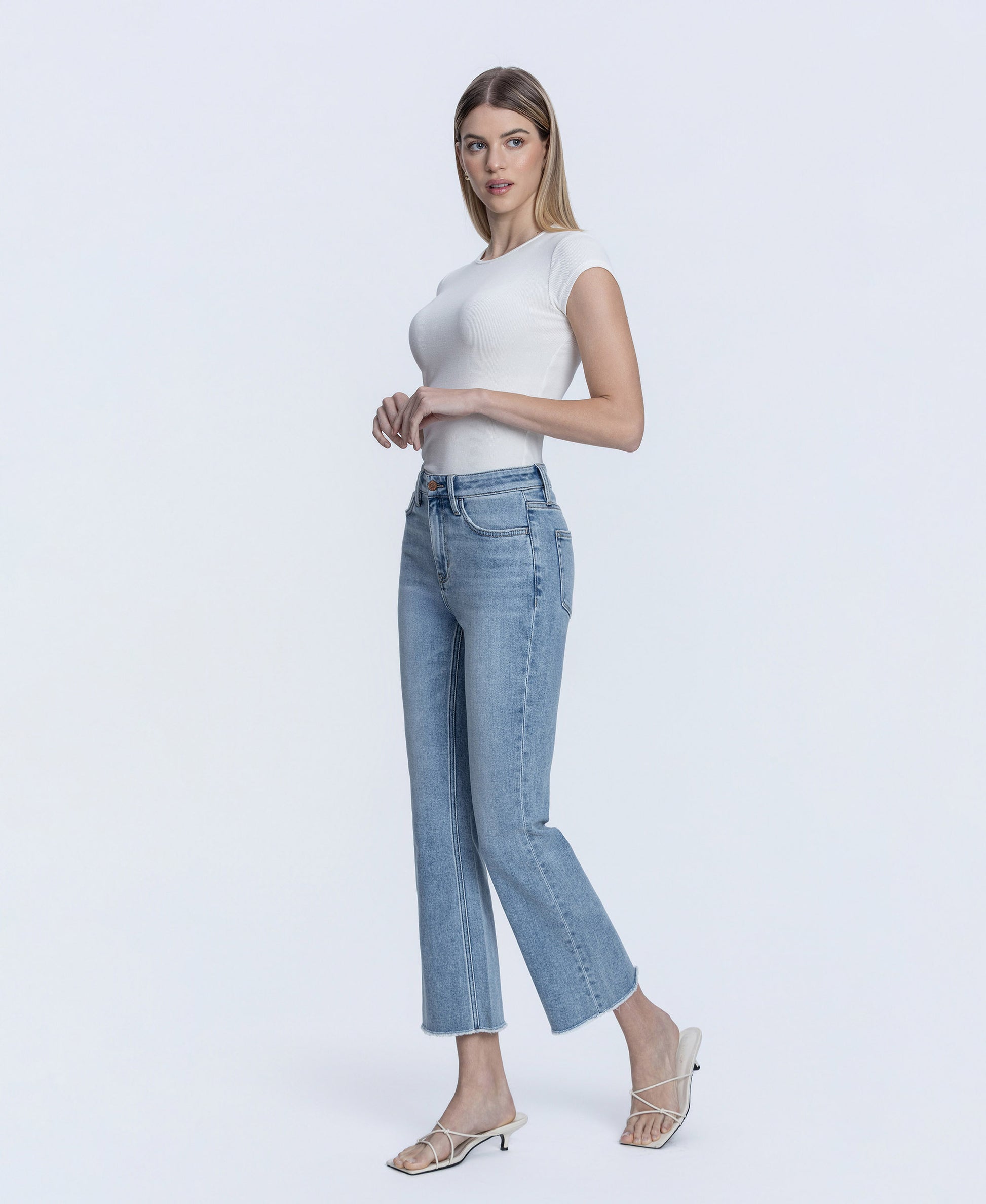 Left 45 degrees product image of Peaceable - High Rise Raw Hem Kick Flare Jeans